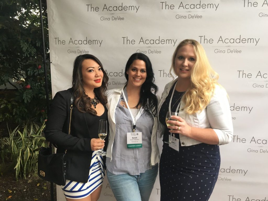 Three women at a conference.