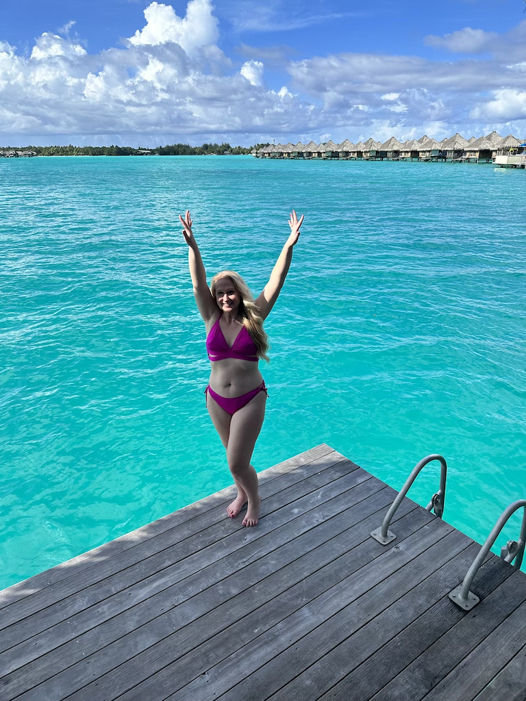 Woman in a bikini on a pier.